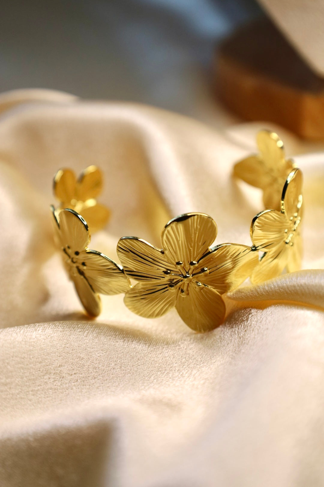 Gold hibiscus bangle