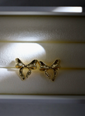 Gold bow stud earrings