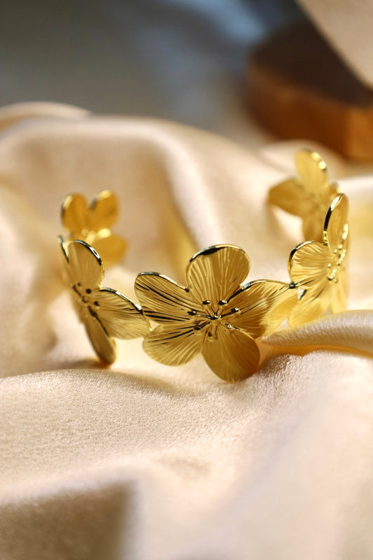 Gold hibiscus bangle