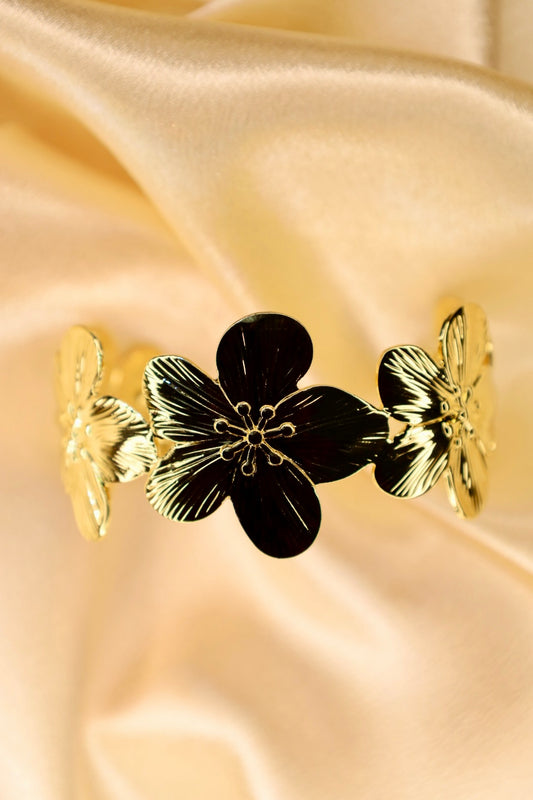 Gold hibiscus bangle